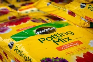a stack of miracle gro soil